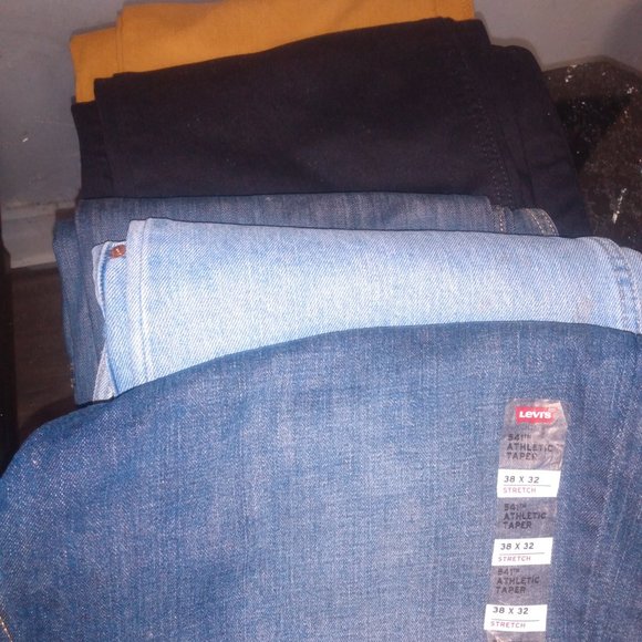 4 pairs of Levi's Jeans and 1 pair of Sean John